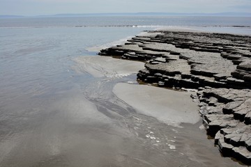 BARRY, VALE OF GLAMORGAN / WALES - APRIL 15 2020: elderly people take daily exercise in the sunshine during the COVID_19 lockdown making sure they are complying with social distance rules