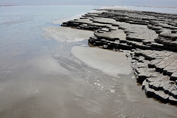 BARRY, VALE OF GLAMORGAN / WALES - APRIL 15 2020: elderly people take daily exercise in the sunshine during the COVID_19 lockdown making sure they are complying with social distance rules