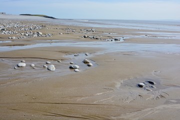 BARRY, VALE OF GLAMORGAN / WALES - APRIL 15 2020: elderly people take daily exercise in the sunshine during the COVID_19 lockdown making sure they are complying with social distance rules