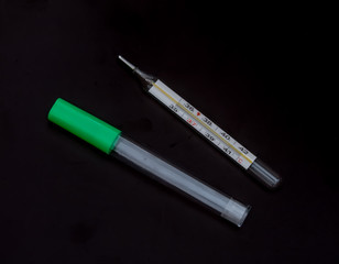 medical thermometer on a black background