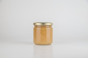 Canned tasty food - Jam jar on white colour background, close up studio object shot. Natural food and healty lyfestyle.