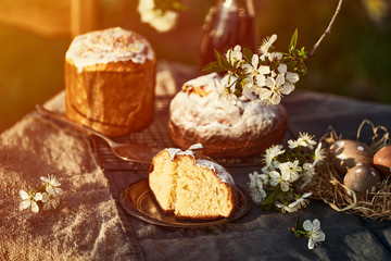 Traditional russian Easter cottage cheese dessert. Orthodox paskha, kulich cakes on table.