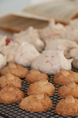 Passover (Pesach) baking - almond macaroon cookies and coconut meringue cakes, presented on a wire cooling tray.