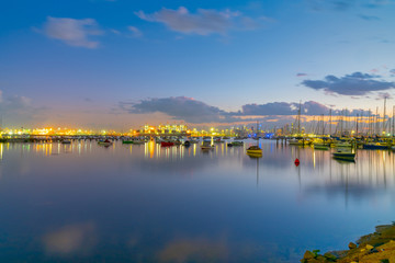 Fototapeta na wymiar Sunrise over waterfront and boats