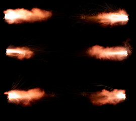 A shot from a firearm on a black background, a fiery exhaust with flying sparks, flames bursting out of the pipe - 336506922