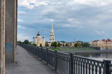 Fototapeta na wymiar Bridge over the Volga river. View of the Transfiguration Cathedral. Rybinsk. Russia