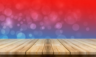 Empty wooden table with a beautiful colour bokeh background