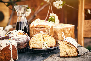Traditional russian Easter cottage cheese dessert. Orthodox paskha, kulich cakes on table.