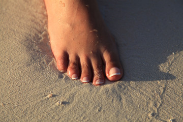 Pied dans le sable