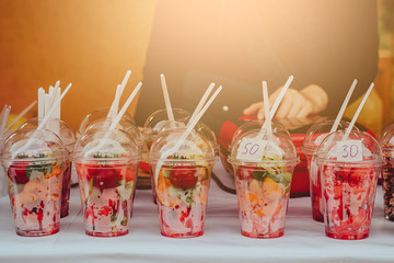 sliced fruit in cups. the concept of proper nutrition