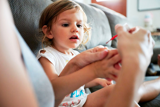 A Young Girl Gets Her Fingernails Painted