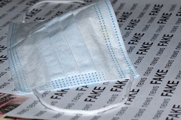antivirus mask on fake newspaper