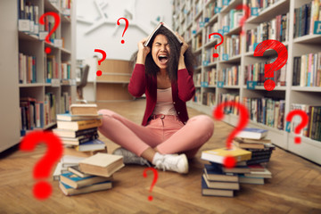 Tired university student has difficulty to study. Concept of stress, question and difficulty