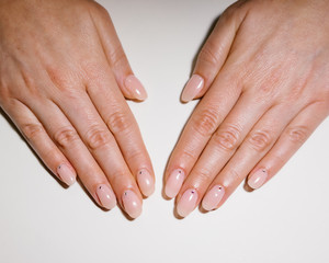 Woman's hand with pink nails