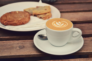 Cup of espresso macchiato and cookies