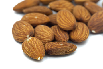 A Close up of almond nuts isolated on a white background