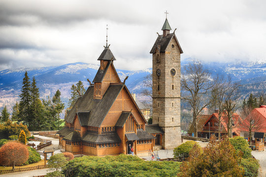 KARPACZ, POLAND - MARCH 09, 2020: Old wooden temple Vang (Wang). Medieval Norwegian stave church which was transferred from Vang in Norway and re-erected in 1842 in Karpacz, Poland, Europe.