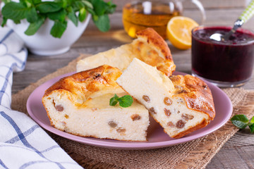 Cottage cheese casserole with raisins and powdered sugar