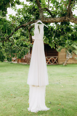 wedding dress white outside garden apple tree