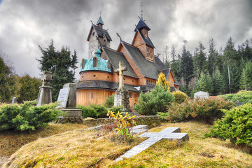 KARPACZ, POLAND - MARCH 09, 2020: Old wooden temple Vang (Wang). Medieval Norwegian stave church...