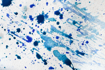 Watercolor splashes on light paper background