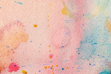 Watercolor splashes on light paper background