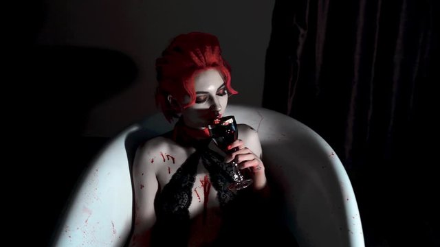 Vampire in black underwear and red hair