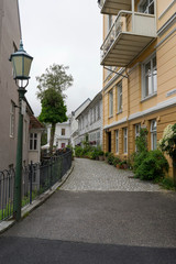 Bergen / Norway - June, 2019: View of street and authentic houses of Bergen.