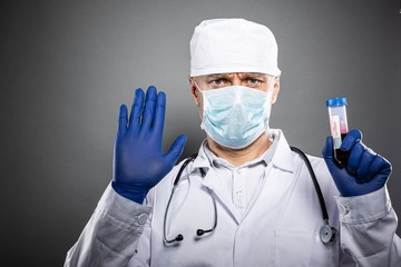 Doctor in white uniform holding coronavirus covid-19 tests