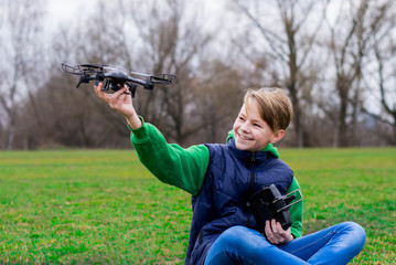 Boy plays with his quadrocopter