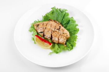 fried chicken whole carcass with vegetables on a white background