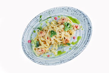 pasta with vegetables and seafood on a white background