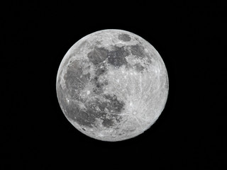 Milan, Italy - April 07 2020: Tonight the moon is at the closest point of 2020 from Earth, view from a quarantined Milan.