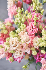 Bunches of flowers different varieties eustoma in vases. Lovely Vintage background with flowers. Wallpapers