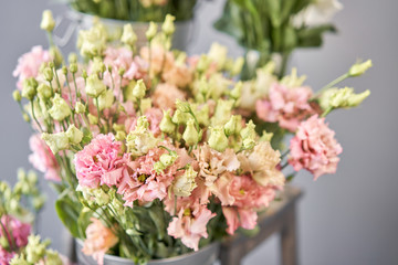 Bunches of flowers different varieties eustoma in vases. Lovely Vintage background with flowers. Wallpapers