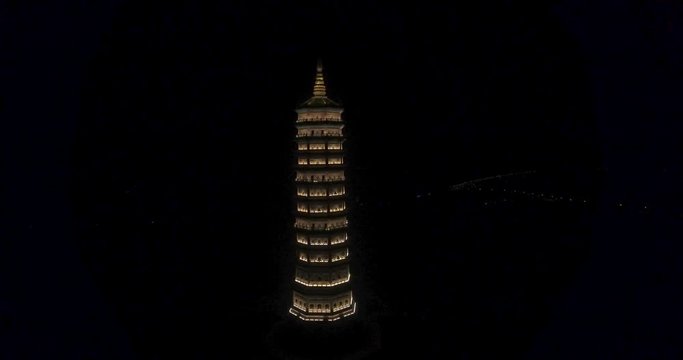 Night Aerial Gentle Rise Shot of Xa Loi stupa at Bai Dinh Temple Spiritual and Culture Complex in Ninh Binh Vietnam, the largest spiritual tourist place in Vietnam