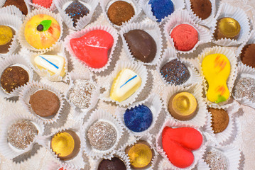 A lot of delicious multi-colored sweets. Close-up.