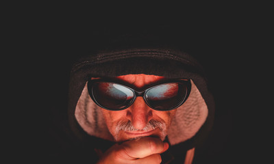 portrait of mature man in front of computer monitor