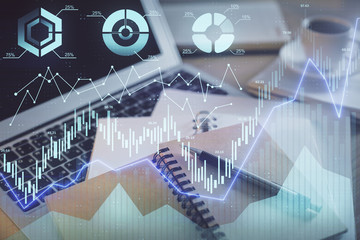 Double exposure of financial chart drawing and desktop with coffee and items on table background. Concept of forex market trading