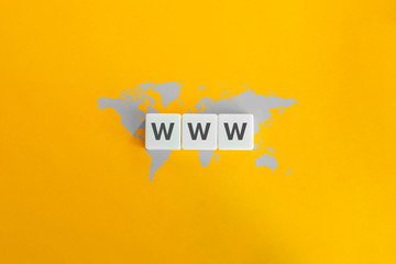 WWW (World Wide Web) on block letters. Grey world map on bright orange background.