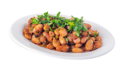 Lobio is a Georgian dish and parsley in a plate isolated on white