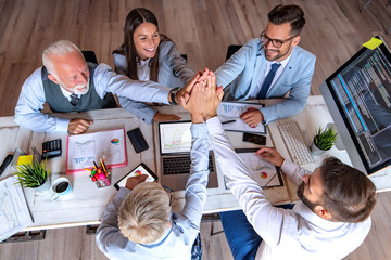Top view of business people with their hands together