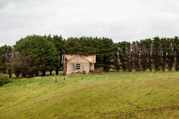 Fototapeta na wymiar Abandoned and derelict old farm building