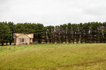 Fototapeta na wymiar Abandoned and derelict old farm building