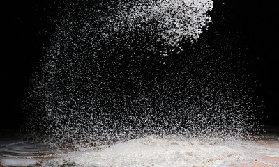 illuminated flour flakes and splits on a dark background