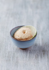 Butter cookies on bright wooden background. Copy space. 