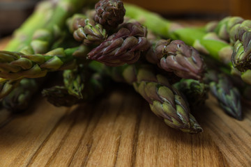 fresh asparagus on wooden table
