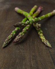 fresh asparagus on wooden table