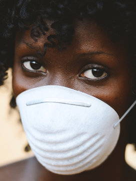 Beautiful African Woman Student Posing with Virus Mask To Protect Herself