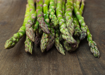 fresh asparagus on wooden table